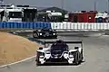 Un Ligier JS P217 en la curva 4.