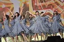 Members of Nogizaka46 performing on stage