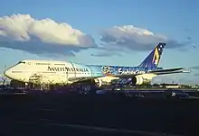 Boeing 747-300 de Ansett con los colores de los Juegos Olímpicos de Sídney 2000 en el Aeropuerto Internacional Kingsford Smith de Sídney (1999)