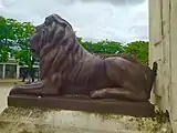Lion Bronze Statue and part of Christopher Columbus Statue Monument in Colón, Cuba