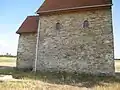 Lado septentrional con ventanas con arcos originales con clave