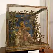 Niño Jesús rodeado de vegetación (cera vestida de finales del SXVIII)