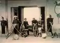 Grupo de militares junto a una Ametralladora Gatling,1894.