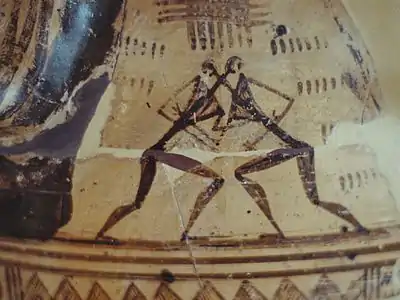 Pieza de cerámica del periodo geométrico con la representación de dos luchadores.