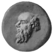 Cabeza de Sileno en relieve, posiblemente utilizado como molde o troquel en cerámica, de época romana.