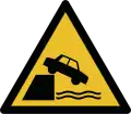 W051 — Ausencia de guardarraíl