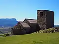 Iglesia de San Esteban con la peña Oroel al fondo