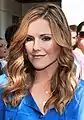 (Kathleen Robertson)Kitty O'Neill, asistente personal de Tom Kane.