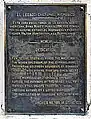 Placa en la base del monumento Los portadores de la antorcha en la Habana.