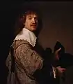 Hombre sosteniendo un sombrero negro (ca. 1637). Rembrandt van Rijn.