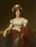 Retrato de medio cuerpo de una mujer con vestido y turbante blanca y túnica roja.