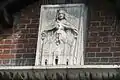 Escudo de armas de la Fabbrica del Duomo, con la fachada de la basílica vetus que ya no existe, la primera catedral de Milán luego reemplazada por el Duomo