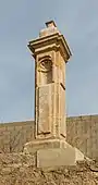 Detalle del peirón de San Sebastián.