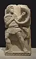 Cornicen íbero en un monumento funerario de Orsu, Osuna en el Museo Arqueológico Nacional de España (siglo I a.C.)