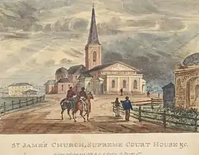 Una impresión antigua. La iglesia y los juzgados se encuentran al tope de una pequeña pendiente con solo unos cuantas construcciones pequeñas visibles. Hay un camino de terracería al cual dos personas en caballo se acercan a la iglesia con otras dos a pie