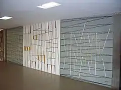 Mural de Víctor ValeraTítulo: Sin título.Año: 1955.Ubicación: Entrada noreste, planta alta, subiendo por la escalera.