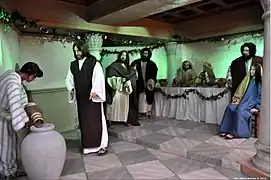 Escena 12: La transformación del agua en vino en las Bodas de Caná